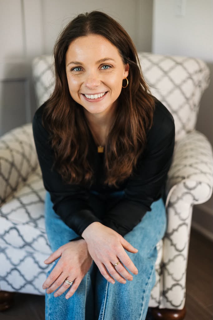 Kati Lawrence, Kansas City–area Realtor, smiling in an armchair